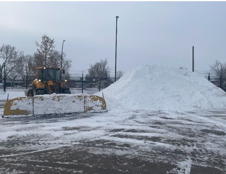 Snow stacked on a cleared commercial lot